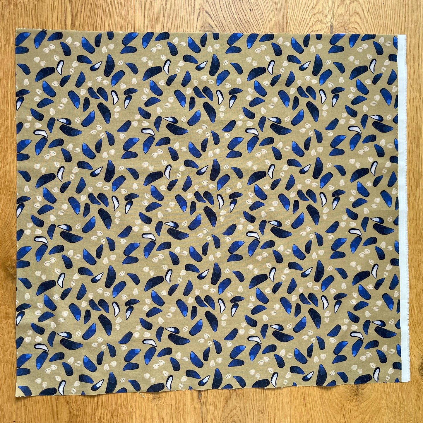 Cockles and mussels fat quarter - sand background