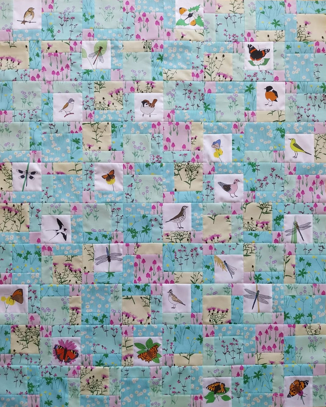 Disappearing nine patch quilt